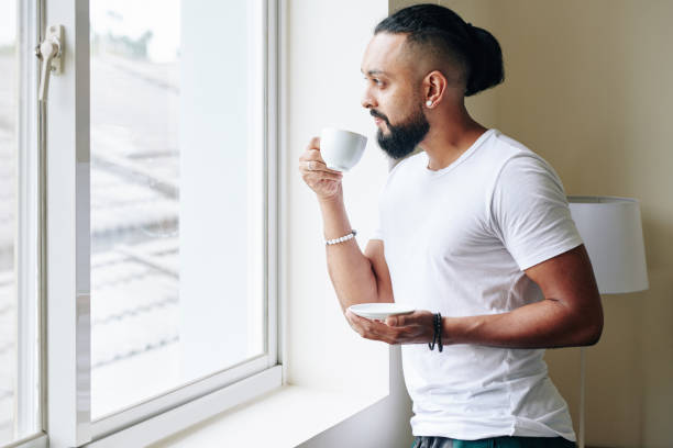 istock Man drinkig morning coffee 1304824462