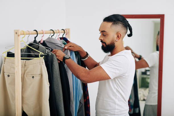 istock Man choosing what to wear 1304824472