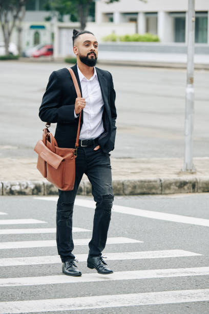 istock Stylish man with crossing road 1304824482