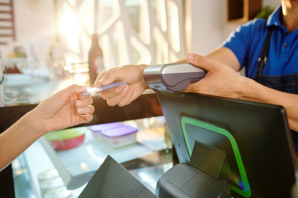 istock Customer paying with credit card 1304826214
