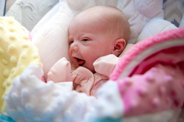 A baby girl with cute eyes was staring intently ahead.