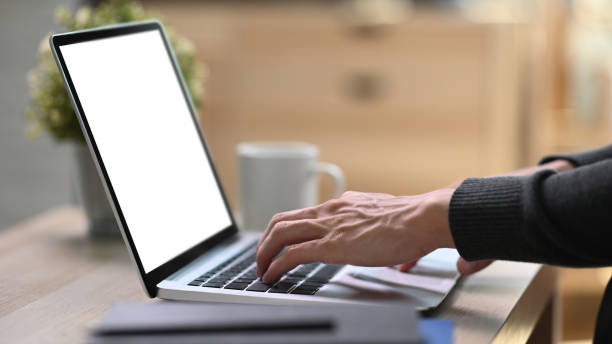 istock Side view of young man freelancer hands typing on keyboard of laptop computer. 1304832256