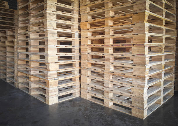 istock Stacked of wooden pallets rack in storage warehouse. 1304837231