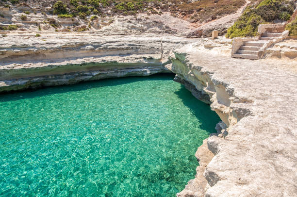 istock Crystal clear turquoise water in St. Peters pool -  beach at Malta 1304838178