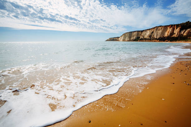 View of the azure sea on a sunny day. View of the azure sea on a sunny day. Location place Island Sicily (Sicilia), Natural Reserve Foce del Fiume Platani, Italy, Europe. Scenic image of the exotic scene. Discover the beauty of earth. spume stock pictures, royalty-free photos & images