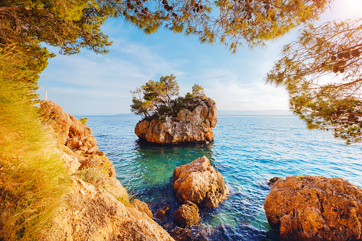 Attractive small islet on Punta Rata beach in Brela. Location place Makarska riviera, Croatia, Dalmatia region, Balkans, Europe. Scenic image of summer holiday season. Discover the beauty of earth.