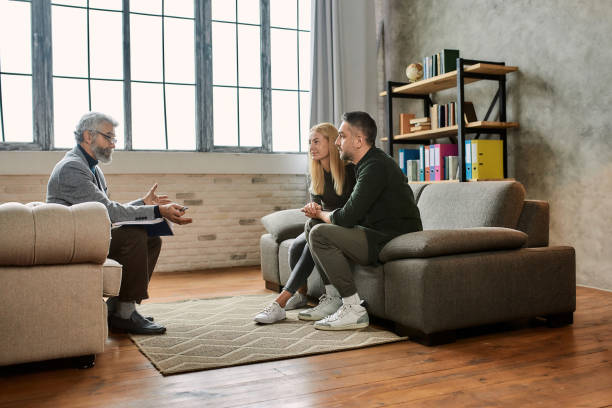 istock Happy caucasian spouses during session with psychotherapist 1304839204