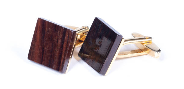 istock Old gilded cufflinks, isolated on white background 1304840413