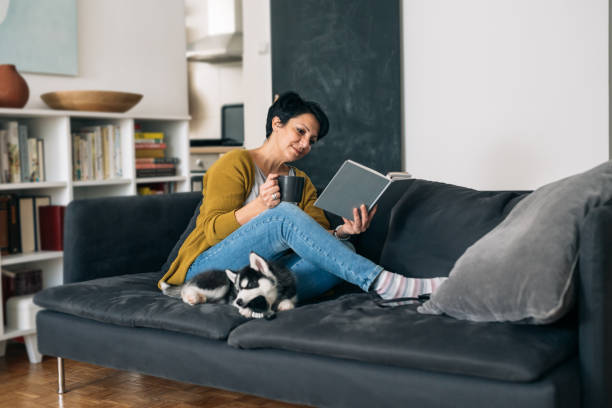 istock woman relaxing at home 1304840475