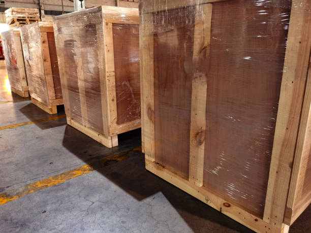 istock Worker sorting shipment cartons box on pallets and wooden case on hand lift in interior warehouse cargo for export and sorting goods in freight logistics transportation industrial, delivery service 1304842286