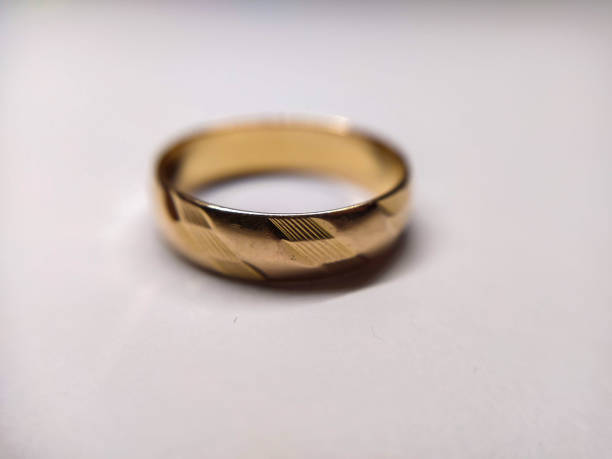 istock Golden ring on the light background close-up 1304843134