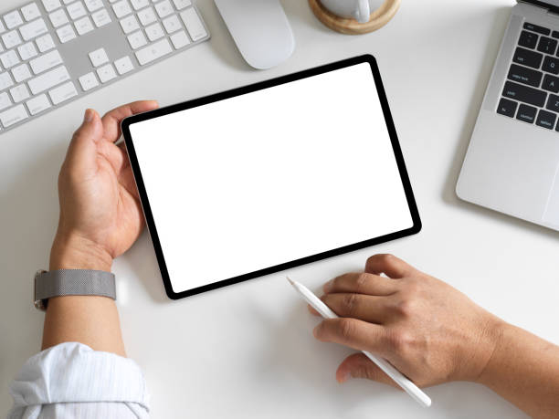 istock Businessman working with digital tablet on workspace with laptop and computer devices 1304844273