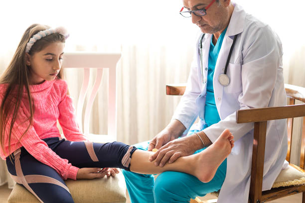 istock Hand putting a plaster on wounded leg to doctor 1304847244