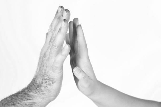 istock The man's hand tries to touch the woman's hand 1304847395