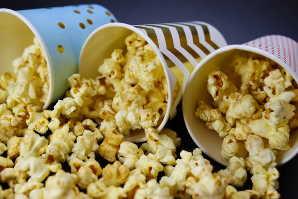 istock caramel popcorn spilled out of paper cups 1304848470