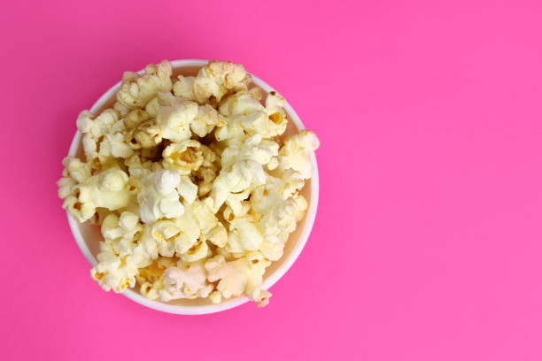 istock caramel popcorn in a ceramic bowl, top view. Copy space for text 1304848593