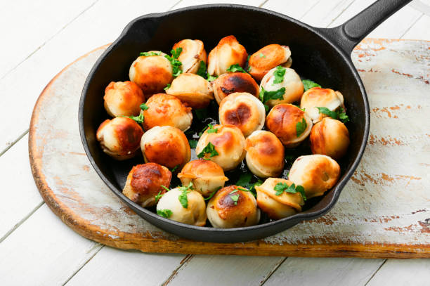 Delicious fried dumplings Fried dumplings stuffed with beef meat.Tasty roasted pelmeni on iron cast pan russian pelmeni stock pictures, royalty-free photos & images