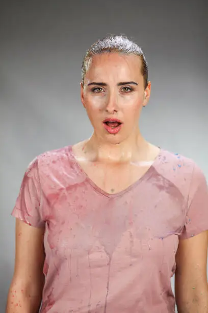 Caucasian woman after splash of water. Not very happy.