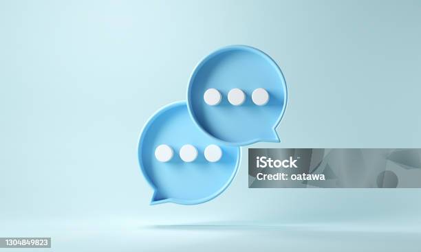 Two Bubble Talk Or Comment Sign Symbol On Blue Background Stock Photo - Download Image Now