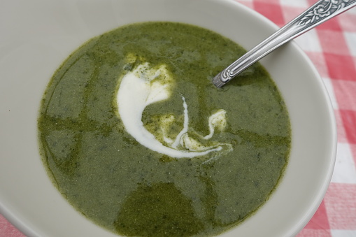 Watercress and potato soup served with sour cream