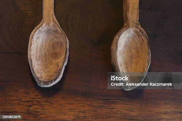 Two Wooden Spoons On A Wooden Table Stock Photo - Download Image Now - Art, Brown, Bushcraft