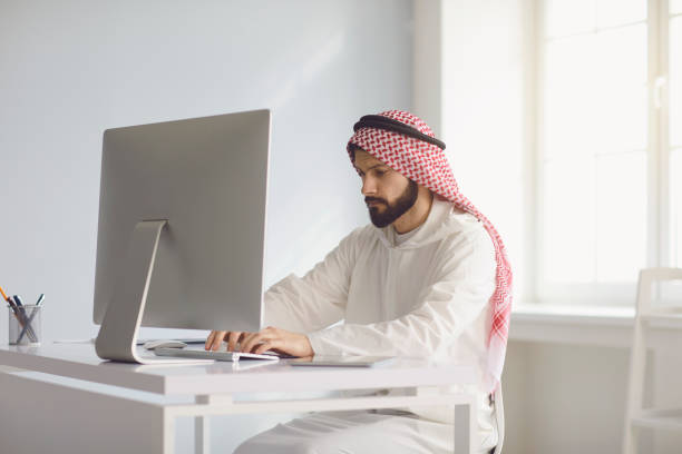 istock Arab businessman worker works in computer on the workplace in the office. 1304853475