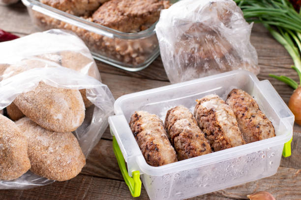 istock Frozen cutlets or meatballs in plastic bag on a table, ready to eat 1304854810