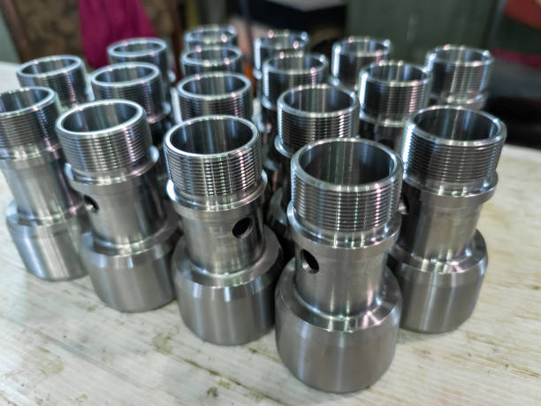 istock shiny bare steel parts after cnc turning operations close background 1304859009