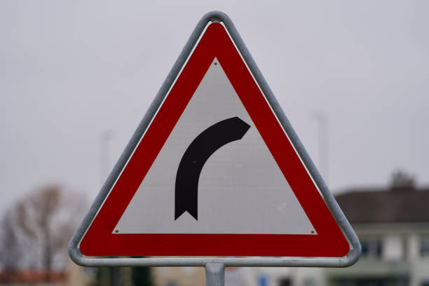 istock Traffic sign dangerous right hand bend. 1304861502