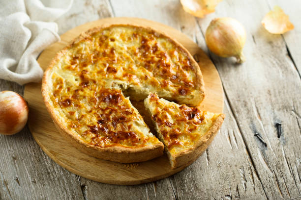 Onion pie or quiche Traditional homemade onion pie or quiche pepper cake stock pictures, royalty-free photos & images