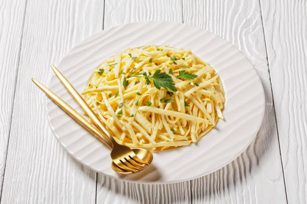 istock Celery Root Remoulade, classic bistro salad julienned celery root melds with a Dijon mustard dressing on a white plate 1304863253