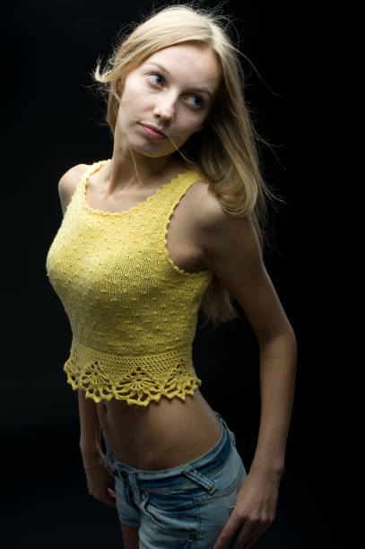 istock Girl at black background 1304863859