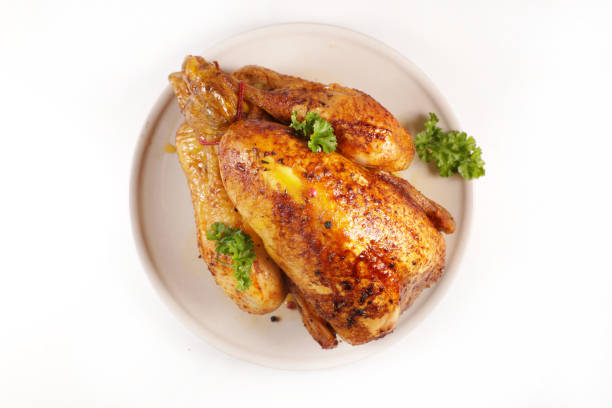 istock roasted chicken isolated on white background 1304863958