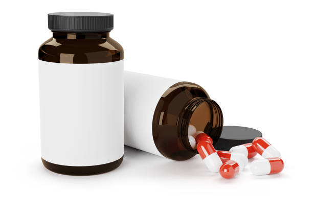 istock Medical bottle with blank label and pills. Isolated on white 1304865416