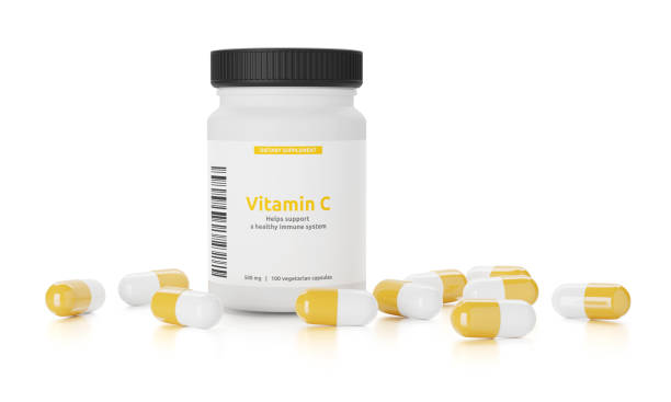 istock Vitamin C or ascorbic acid pills in a bottle. Isolated on white 1304865484