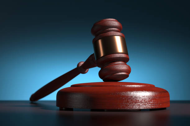 istock wooden judge gavel and soundboard - selective focus - 3d render 1304867542