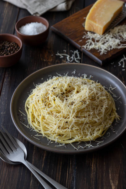 Roman pasta spaghetti with black pepper and cheese. Cacio e pepe. Recipes. Wine. Roman pasta spaghetti with black pepper and cheese. Cacio e pepe. Recipes. Wine. Vegetarian food. National cuisine. pecorino romano stock pictures, royalty-free photos & images