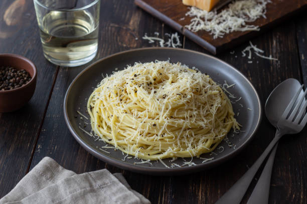 istock Roman pasta spaghetti with black pepper and cheese. Cacio e pepe. Recipes. Wine. 1304870444