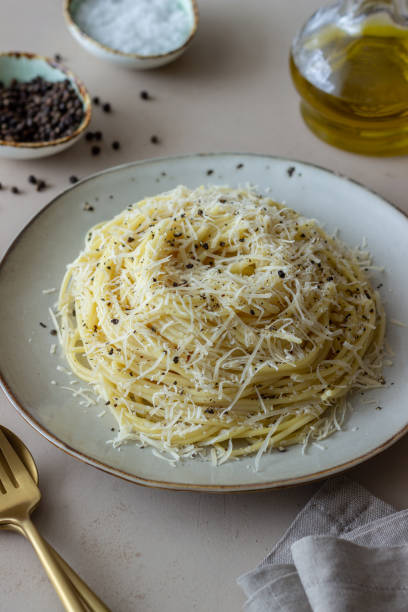 istock Roman pasta spaghetti with black pepper and cheese. Cacio e pepe. Recipes. Wine. 1304870565
