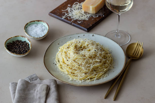 Roman pasta spaghetti with black pepper and cheese. Cacio e pepe. Recipes. Wine. Roman pasta spaghetti with black pepper and cheese. Cacio e pepe. Recipes. Wine. Vegetarian food. National cuisine. pecorino romano stock pictures, royalty-free photos & images