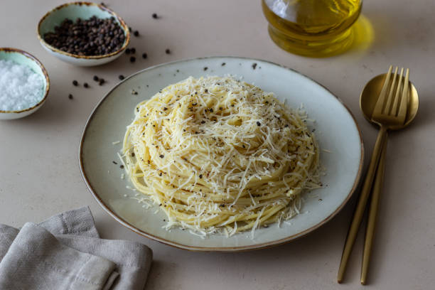 Roman pasta spaghetti with black pepper and cheese. Cacio e pepe. Recipes. Wine. Roman pasta spaghetti with black pepper and cheese. Cacio e pepe. Recipes. Wine. Vegetarian food. National cuisine. pecorino romano stock pictures, royalty-free photos & images