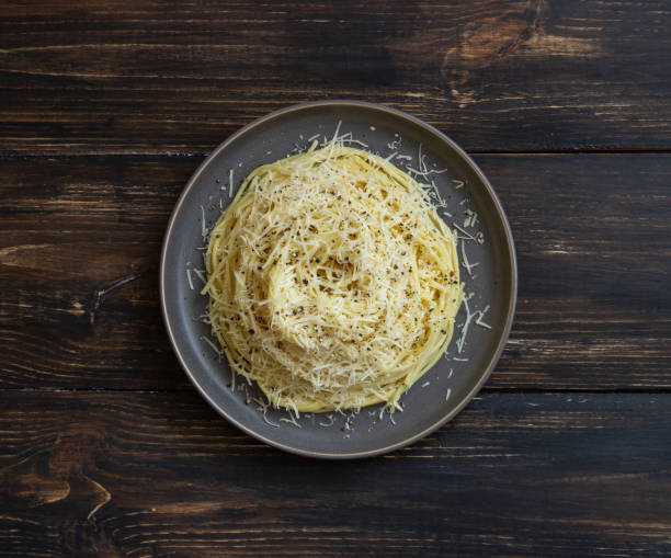 Roman pasta spaghetti with black pepper and cheese. Cacio e pepe. Recipes. Wine. Roman pasta spaghetti with black pepper and cheese. Cacio e pepe. Recipes. Wine. Vegetarian food. National cuisine. pecorino romano stock pictures, royalty-free photos & images