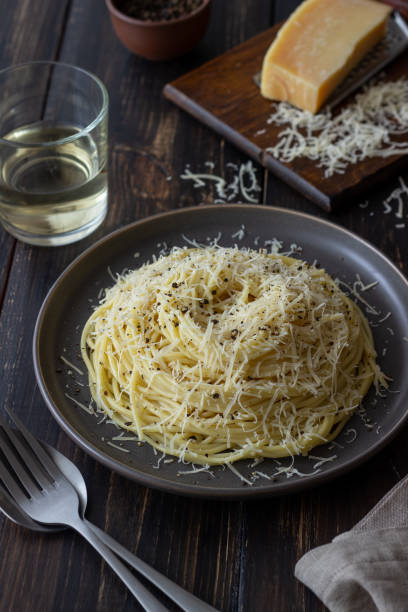istock Roman pasta spaghetti with black pepper and cheese. Cacio e pepe. Recipes. Wine. 1304871359
