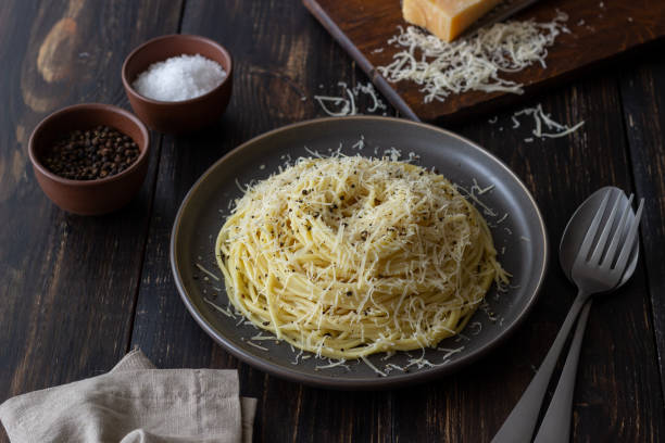 istock Roman pasta spaghetti with black pepper and cheese. Cacio e pepe. Recipes. Wine. 1304871394