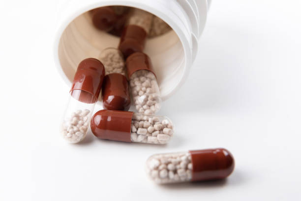 istock Bottle with tablets in the form of capsules on a white background 1304875991