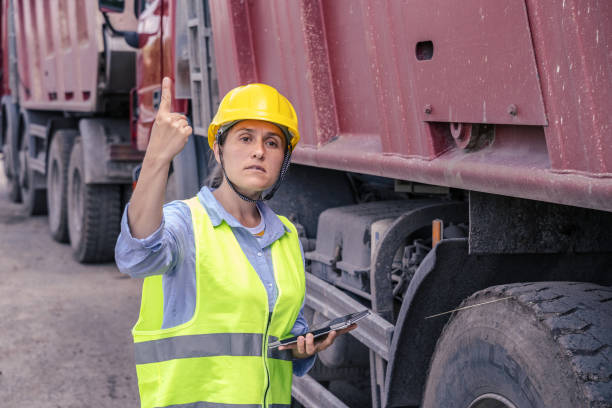 istock Female Construction Engineer working on a road construction site during COVID-19 pandemic. Social distancing and the new normal. 1304876019
