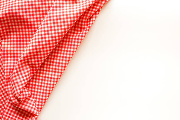 istock Classic pink plaid fabric or tablecloth on white background with copy space. 1304876075