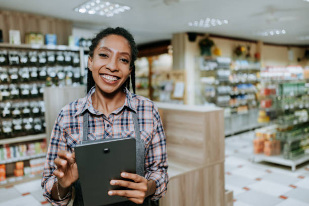 istock Businesswoman portrait, Using Digital Tablet - small business 1304876215