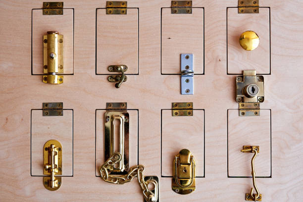istock Many different locks on the wooden door. Stand with types of security systems 1304876559