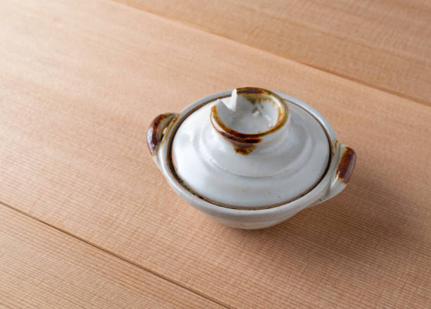 istock Small spice bowl with a lid on a wood table 1304879996